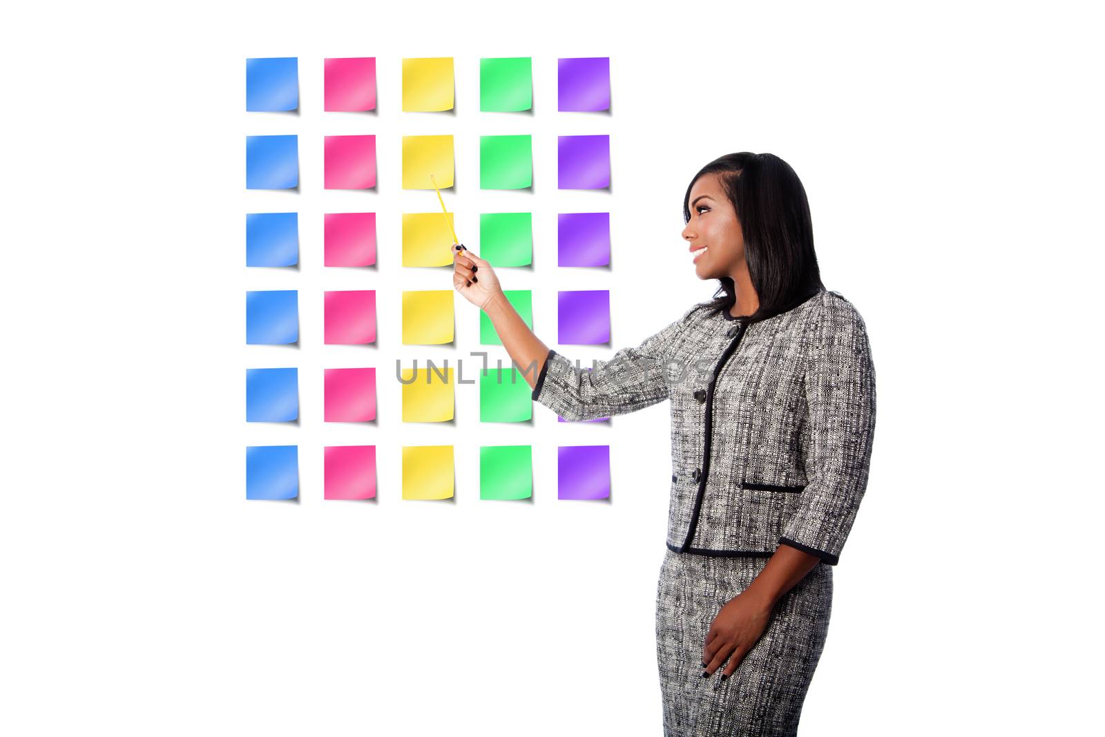 Beautiful happy smiling business woman presenting colorful blank sticky notes, on white.