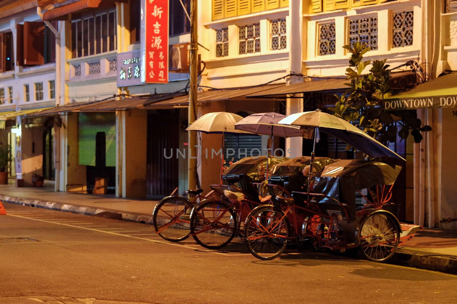 Georgetown, Penang, Malaysia - April 18, 2015: Classic local rickshaws in George Town, Penang in Malaysia by evolutionnow