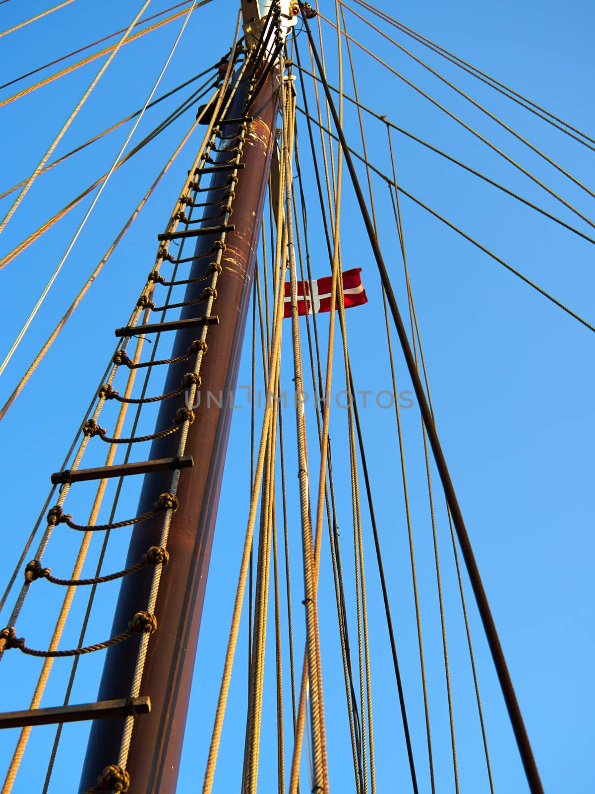 Sailing masts of traditional vintage wooden tallships sky background