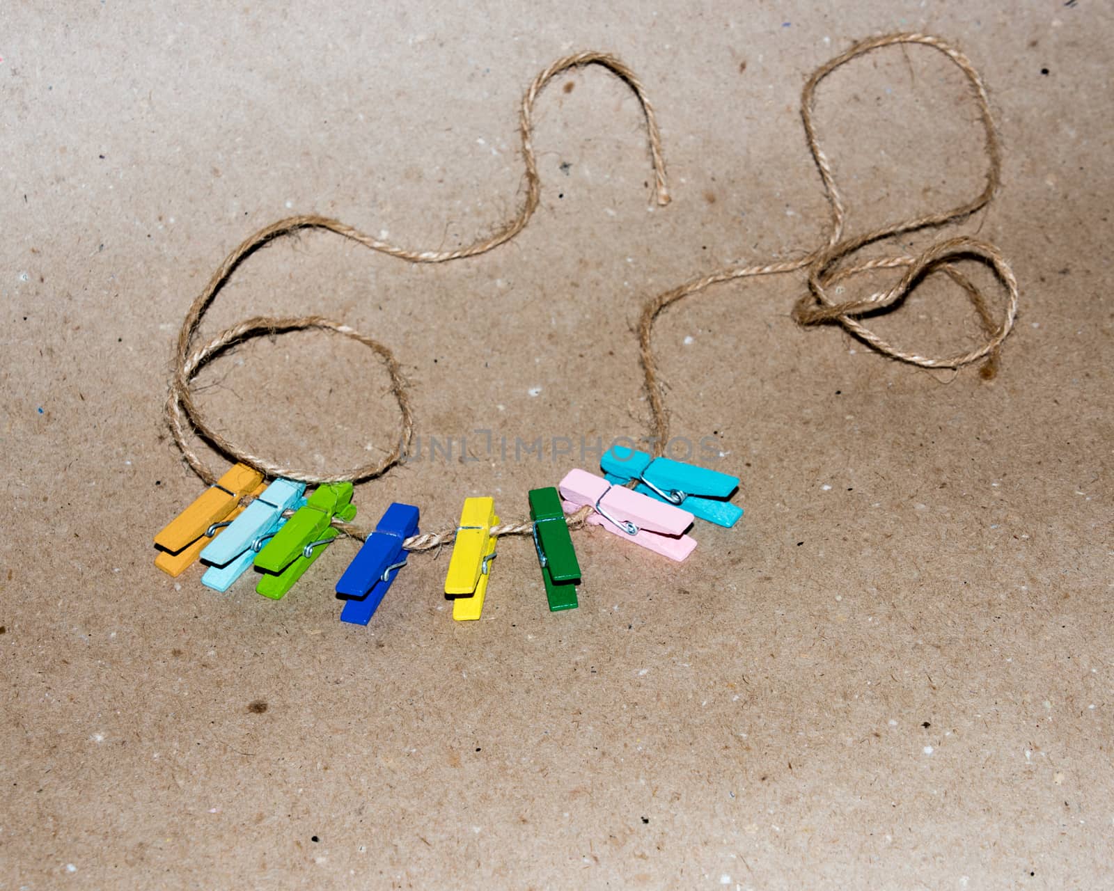 Colorful wooden clothespin. Background of colorful clothes pegs. Closeup of colorful clothespins.

