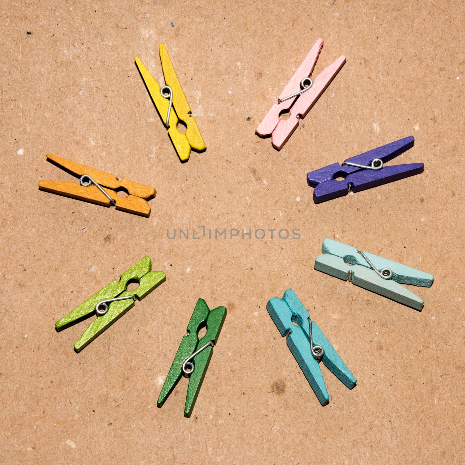 Colorful wooden clothespin. Background of colorful clothes pegs. Closeup of colorful clothespins.

