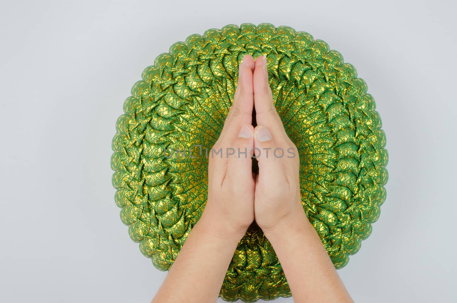 Thai silk Pumkin Pillow and hand on white background