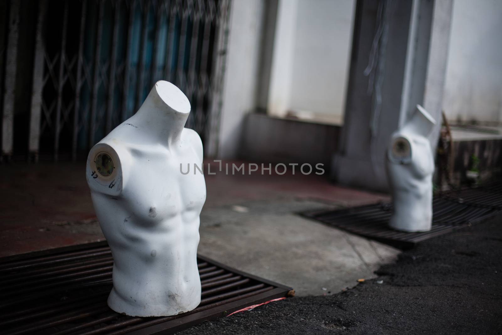 Torso male mannequin stand on the street by Vanzyst