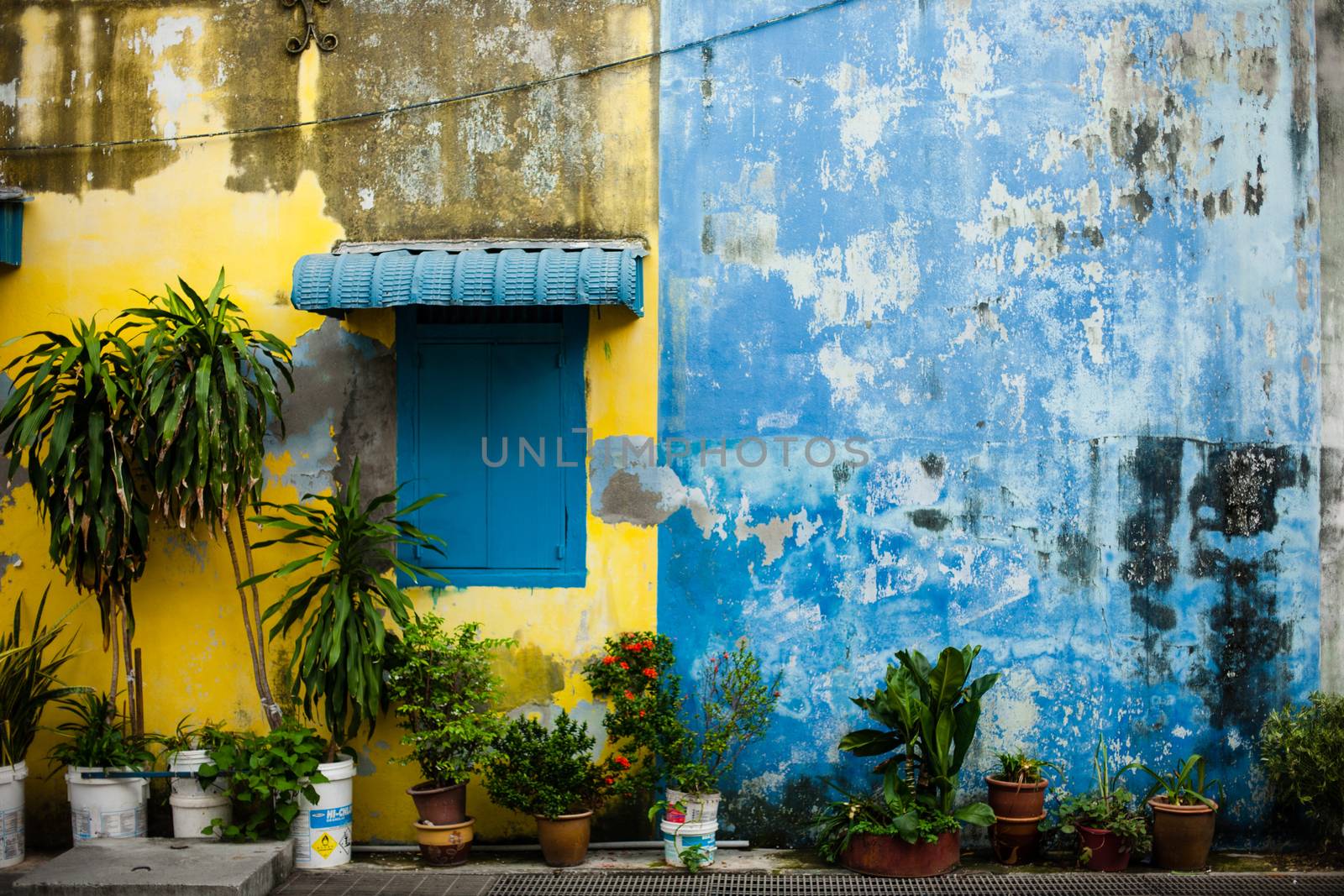 Penang, Malaysia architecture narrow streets. Dirty moldy humidity wall on cityscape