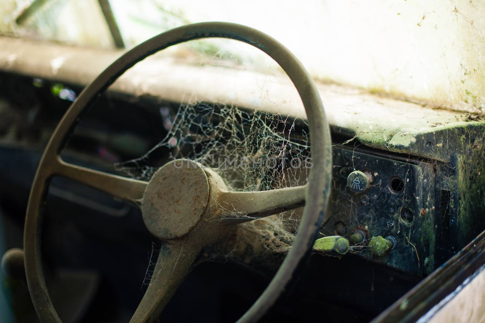 Wheel machines. Part of abandoned old car with cobwebs