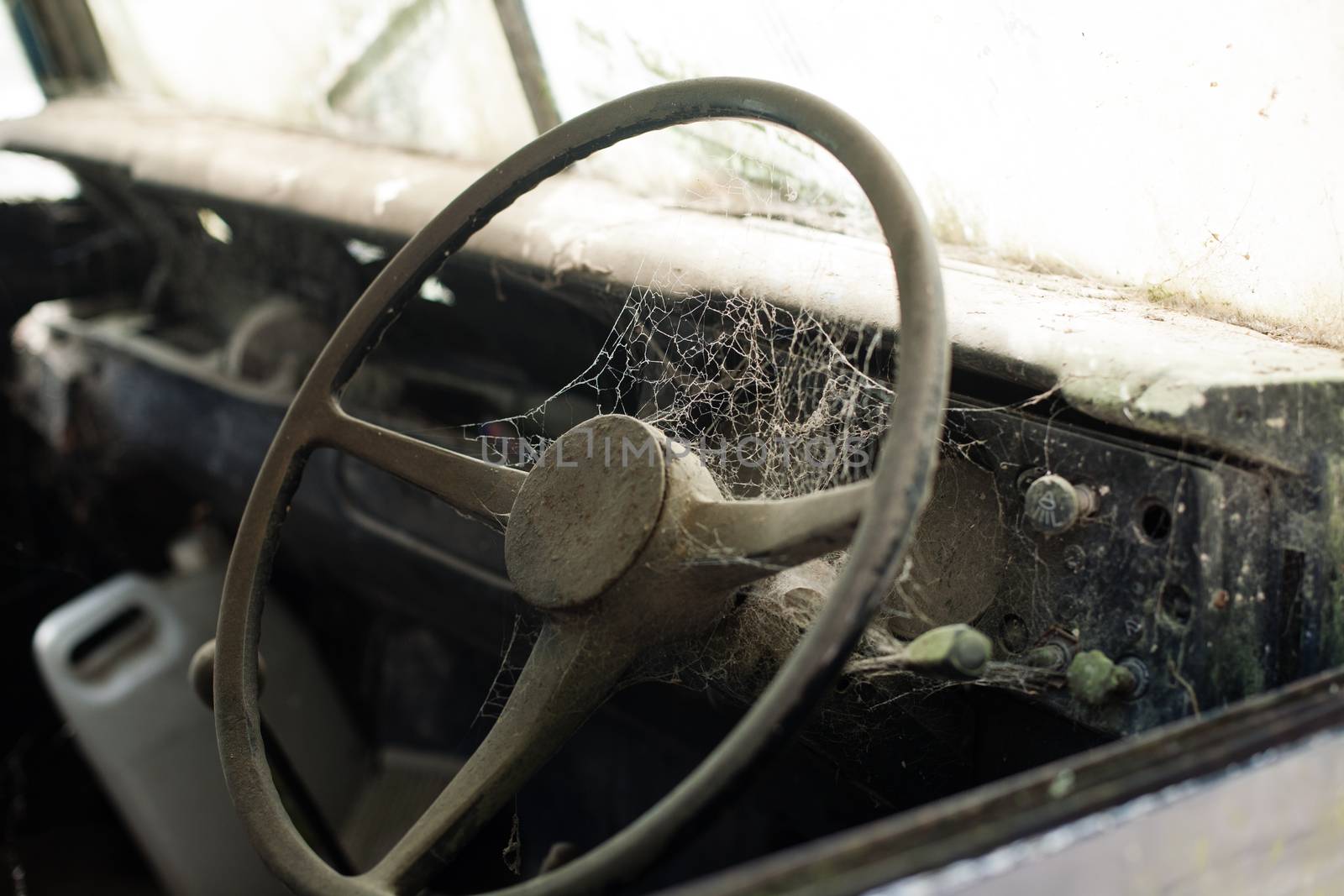 Wheel machines. Part of abandoned old car with cobwebs