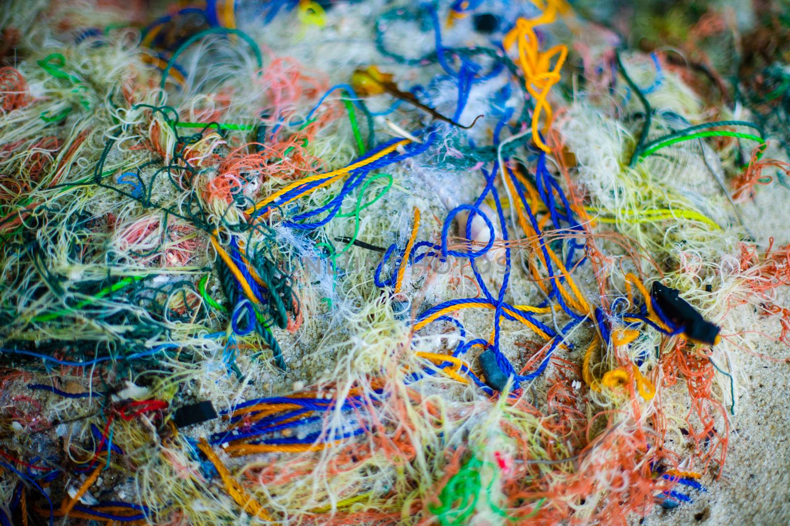 Background of color fishing net and cord rope laces line on the heap