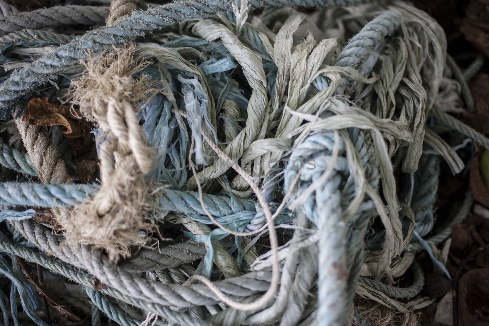 Background of color fishing net and cord on the heap by Vanzyst