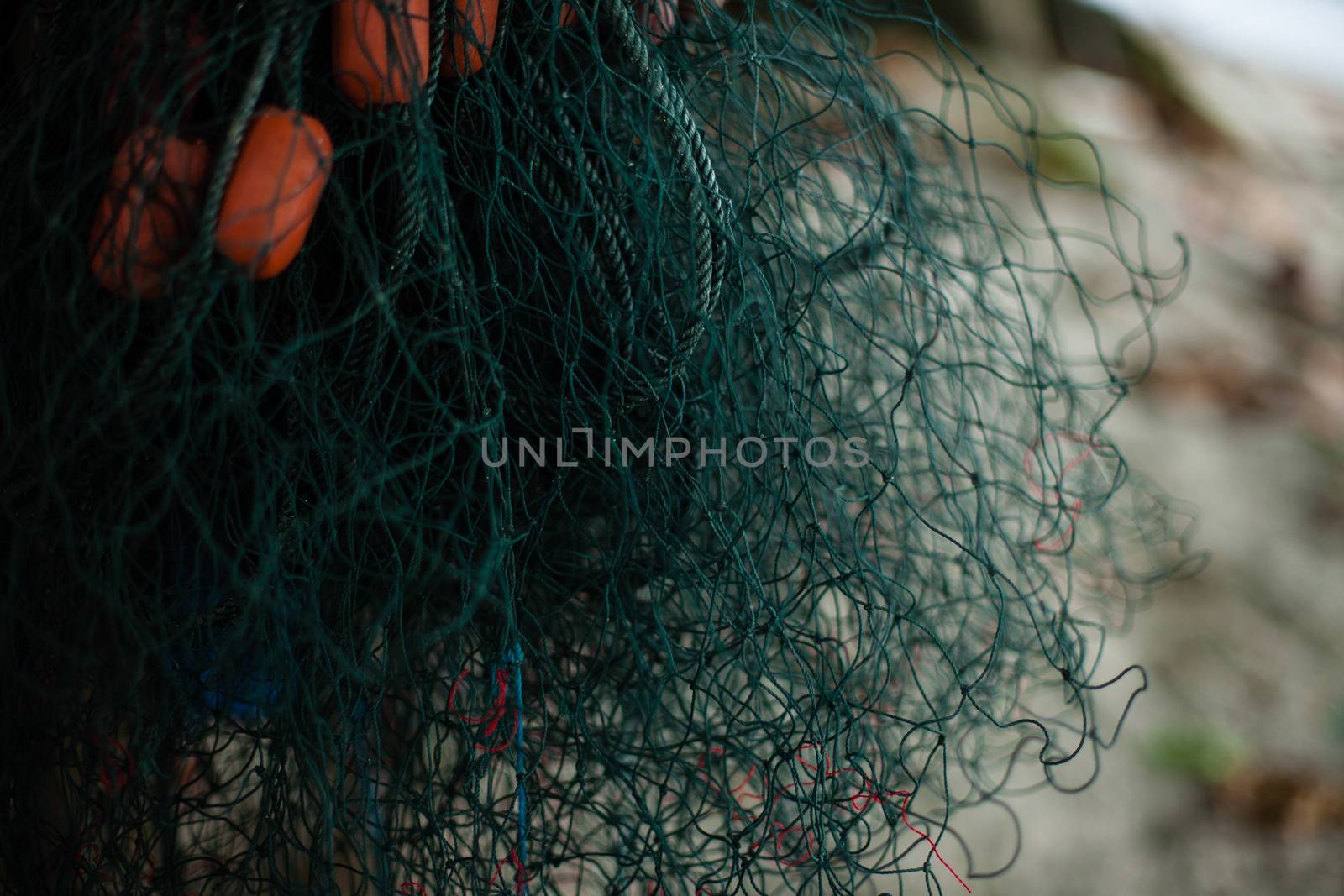 Background of color fishing net and cord on the heap by Vanzyst