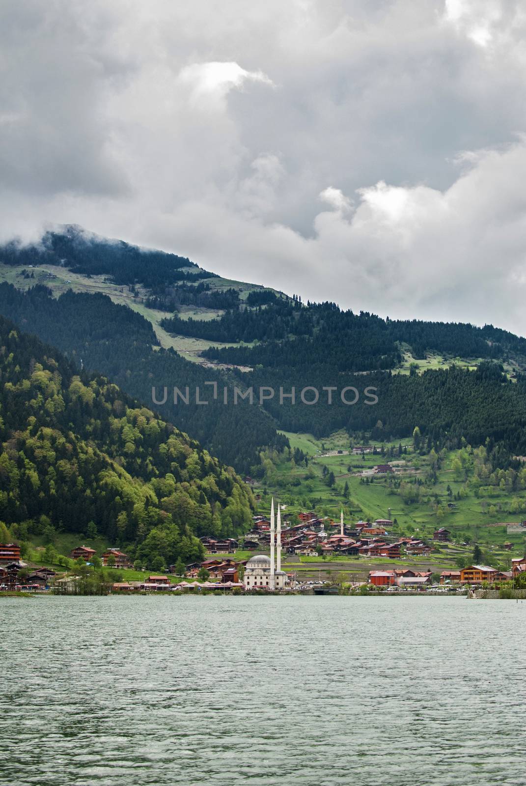 One of the most beautiful tourist places in Turkey. Uzungol - a mountain valley with a trout lake and a small village.