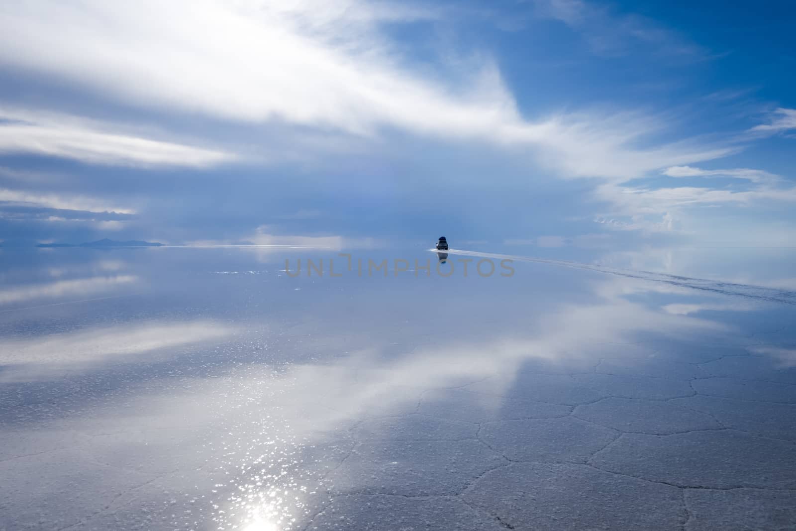 Car in Salar de Uyuni desert, Bolivia by daboost