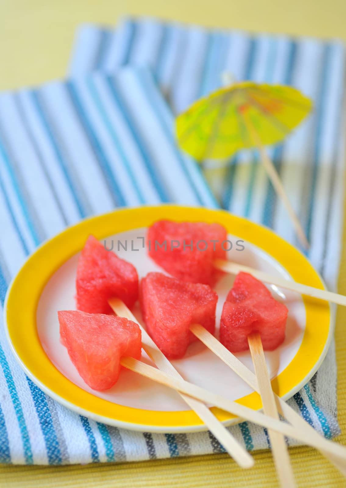 Piece of watermelon hearts shapes on plate