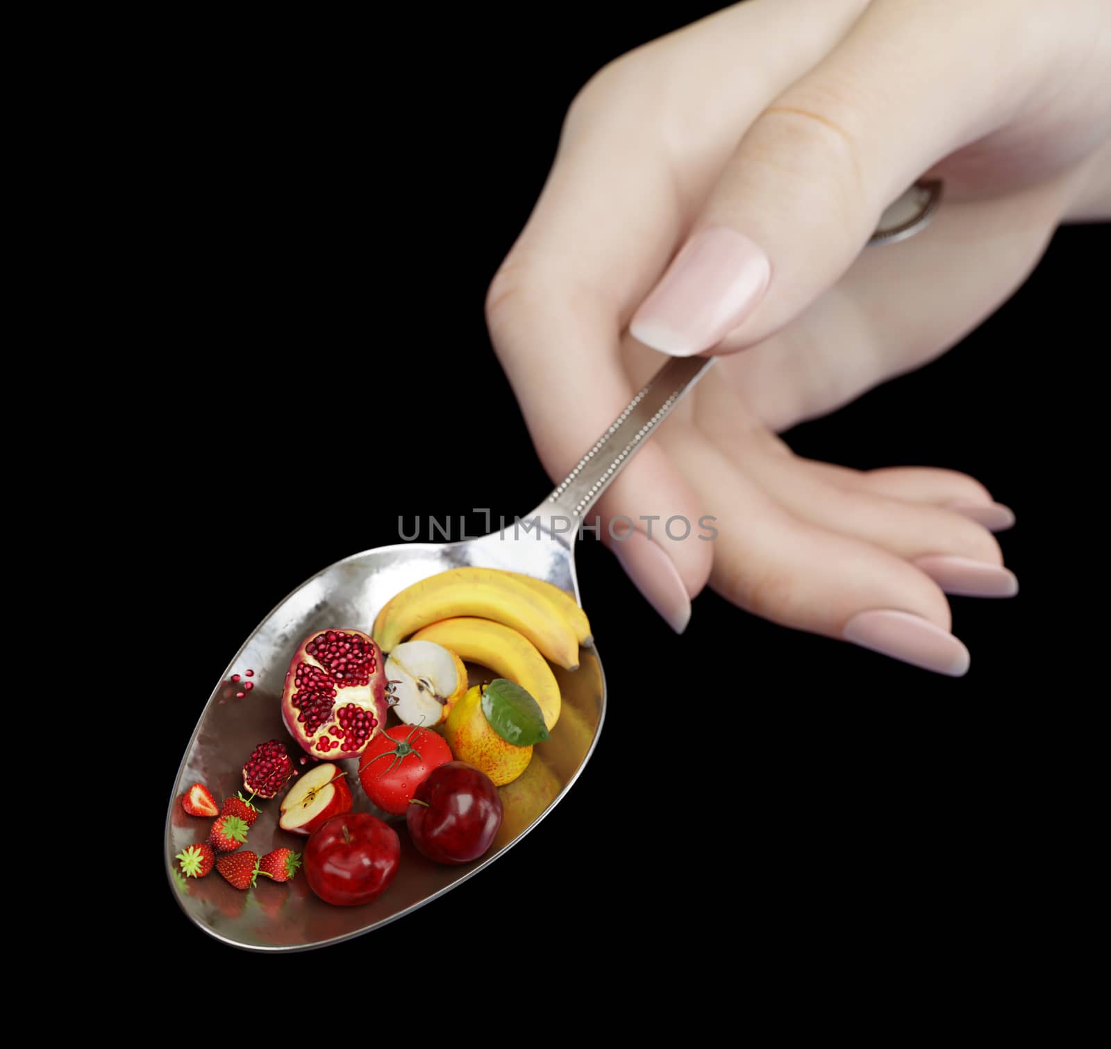 woman hand holding spoon with fruits on isolate black diet concept photo closeup