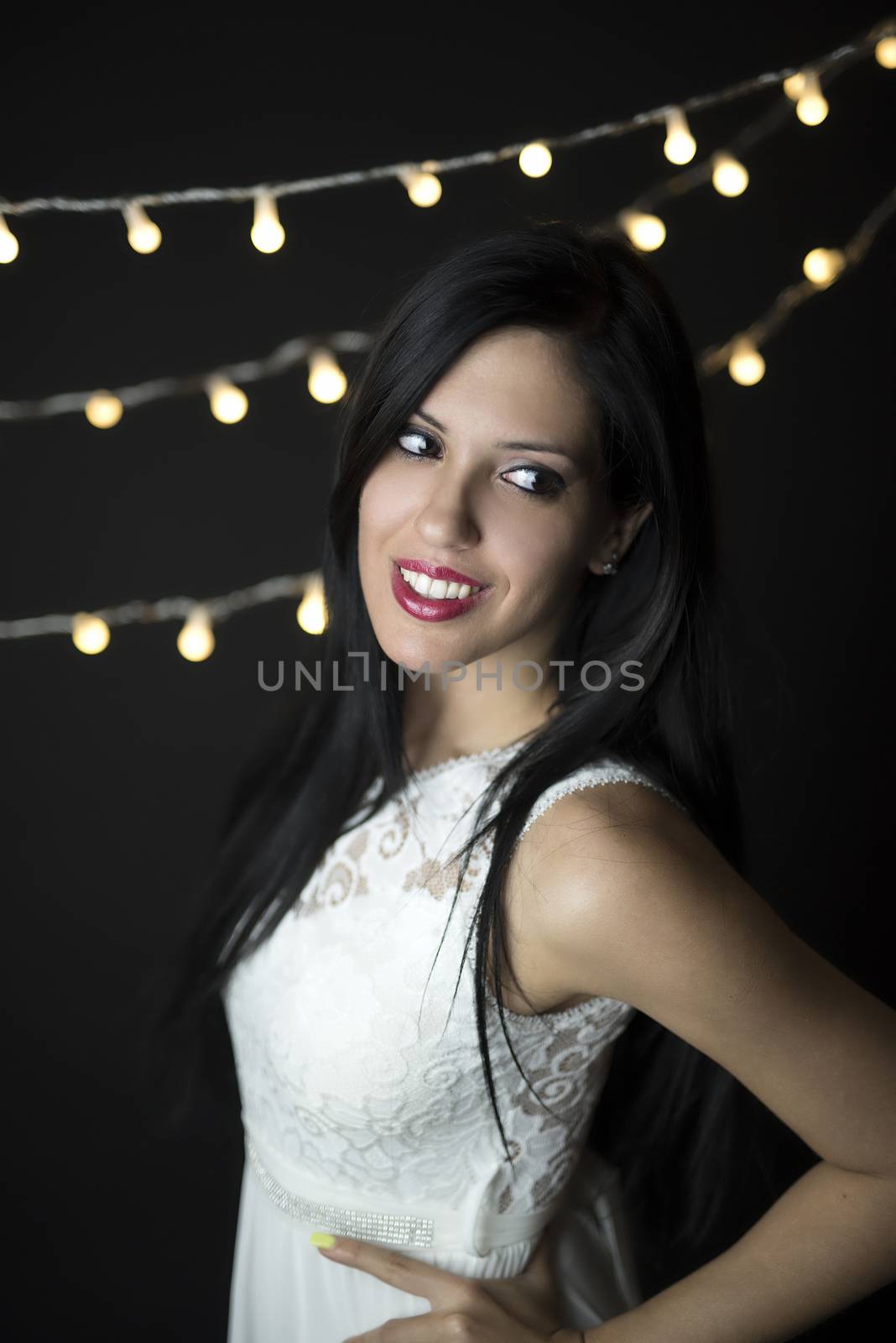 Portrait of a smiling bride in yellow lights