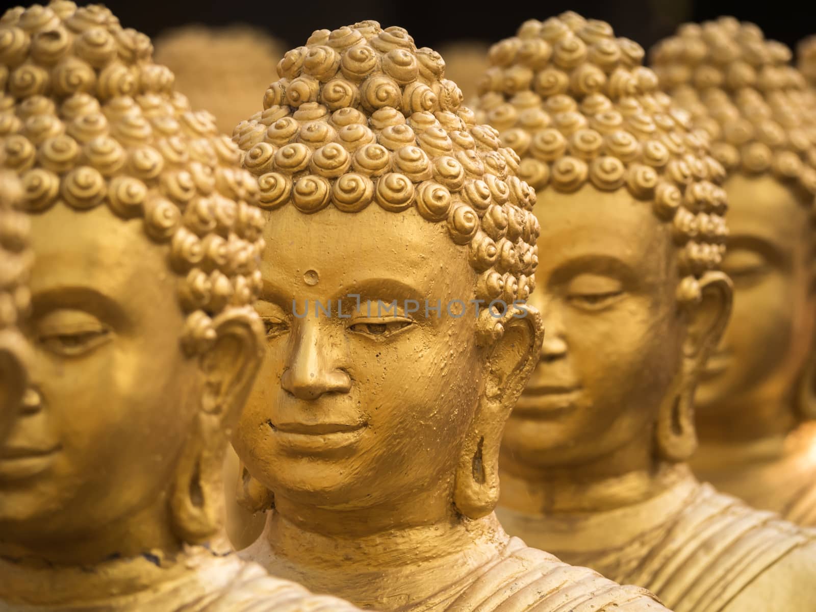 Close-up on head buddha statue, soft focus. by lavoview