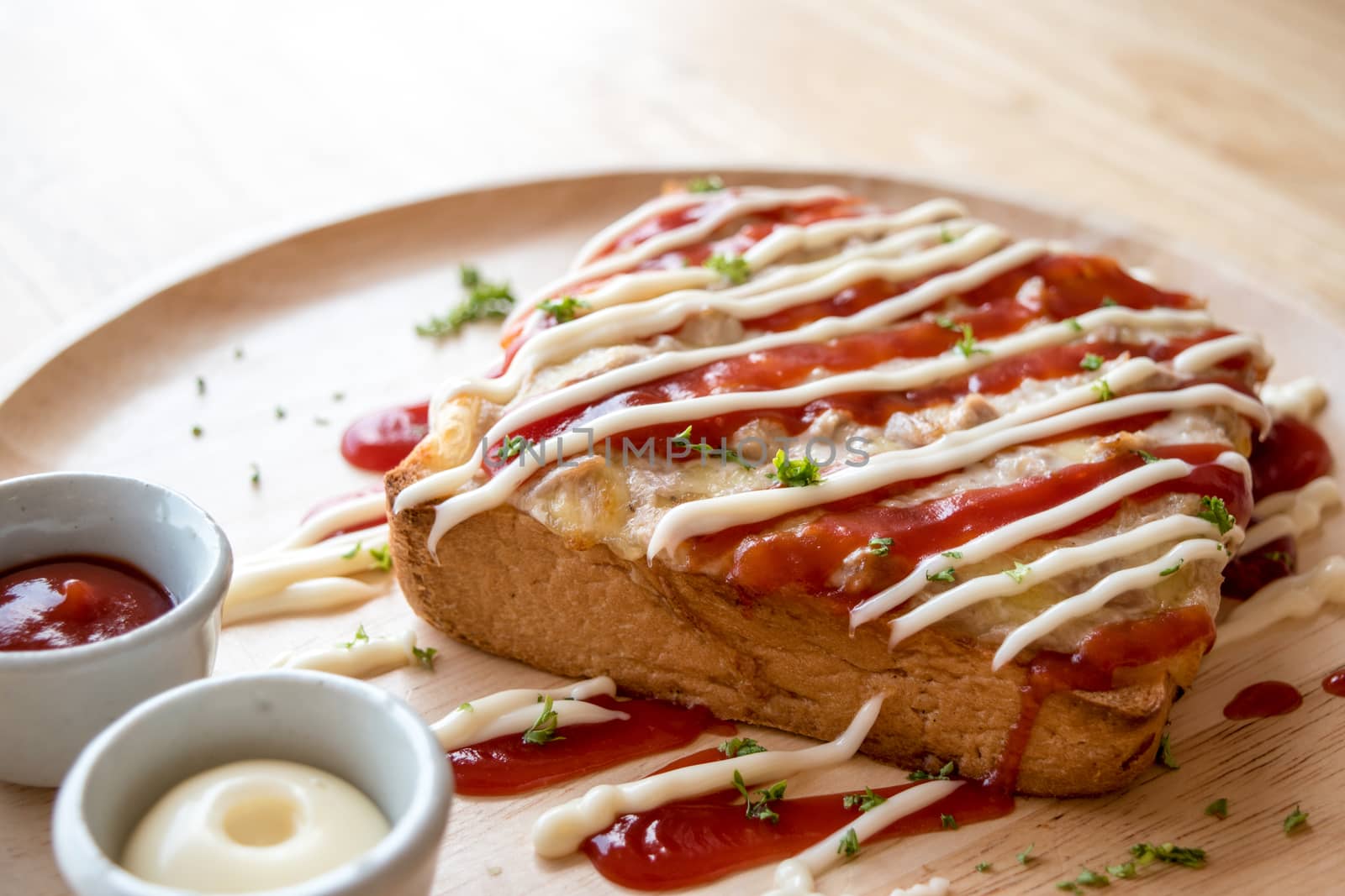 Pizza toasted bread with tomato sauce and ham cheese selective focus