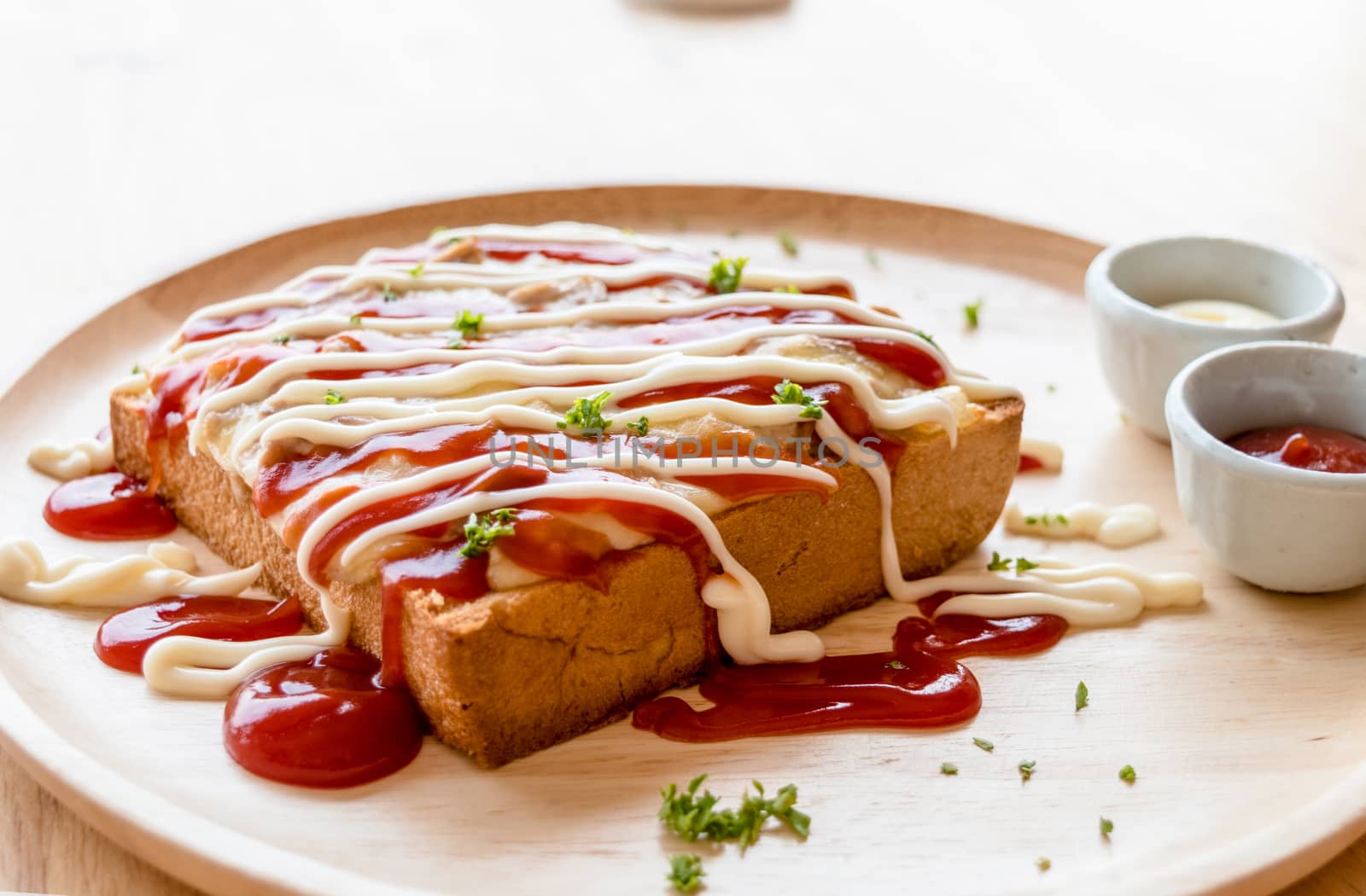 Pizza toasted bread with tomato sauce and ham cheese selective focus.