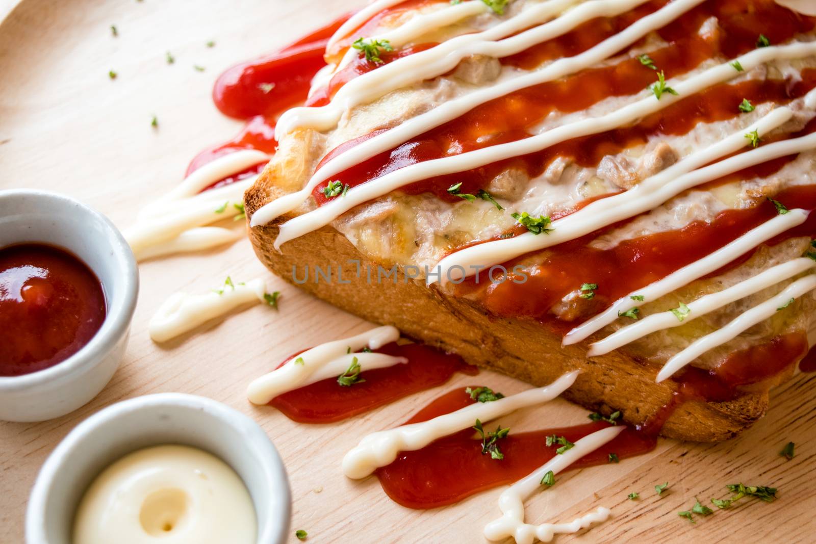 Pizza toasted bread with tomato sauce and ham cheese selective focus