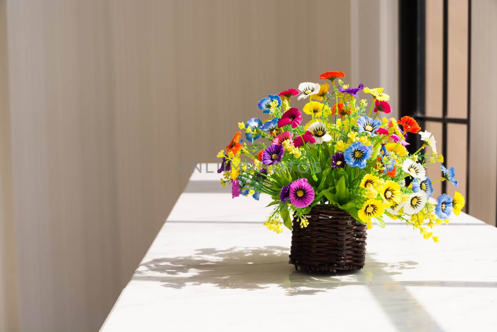 Colorful Flowers in Brown Wood Basket Beside Glass Window by thampapon