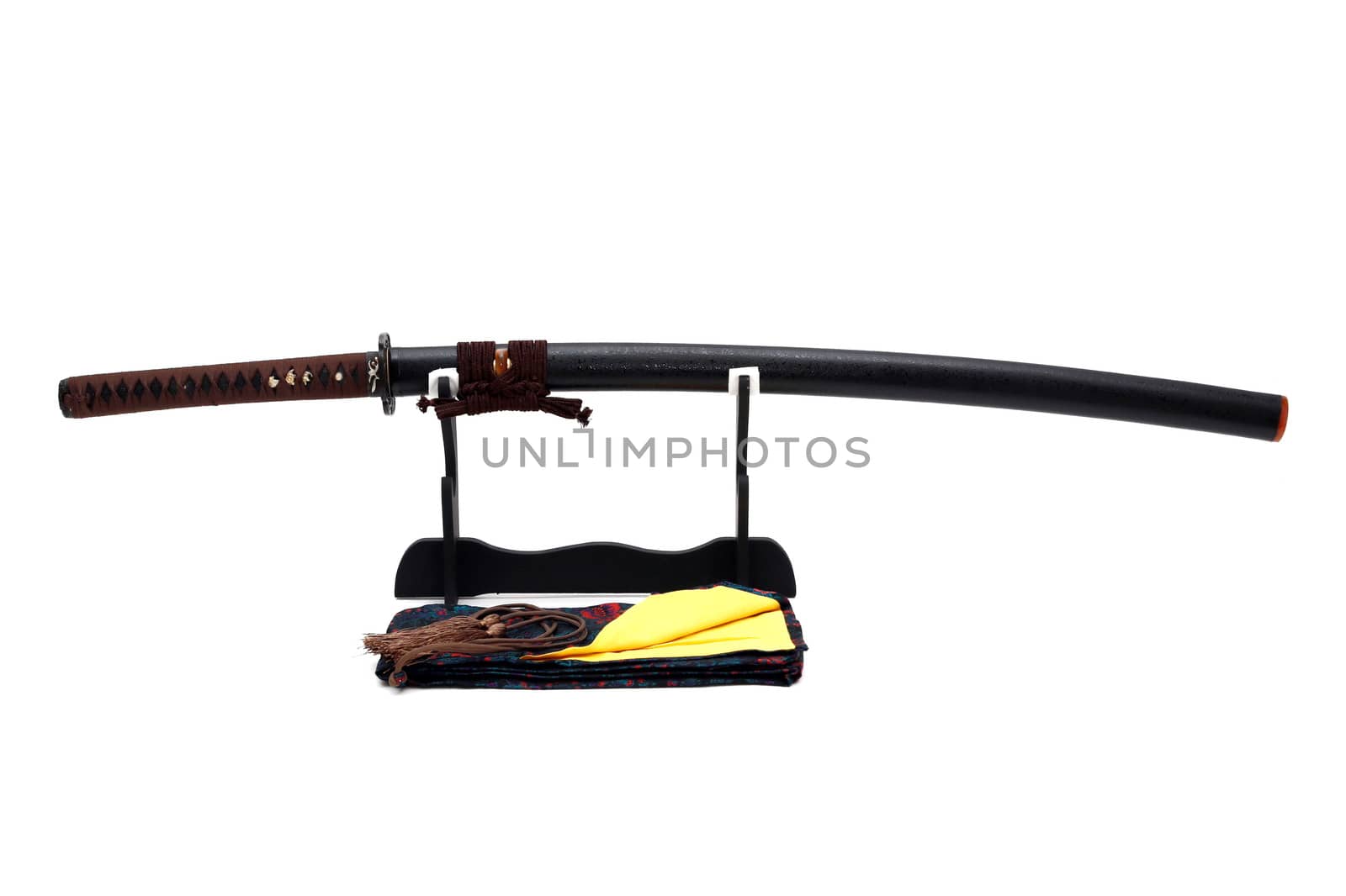 Japanese sword on stand with white background