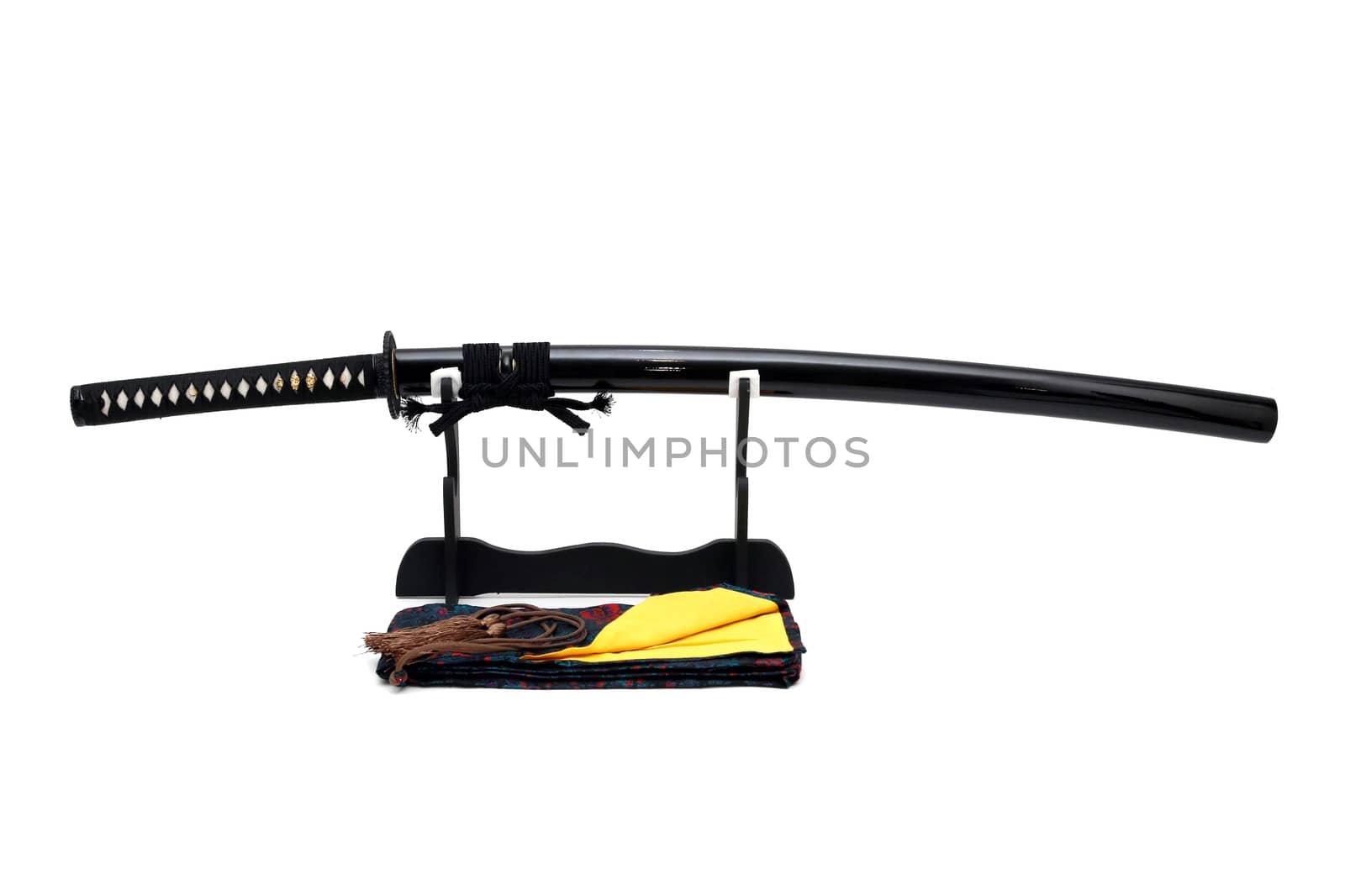 Japanese sword on stand with white background