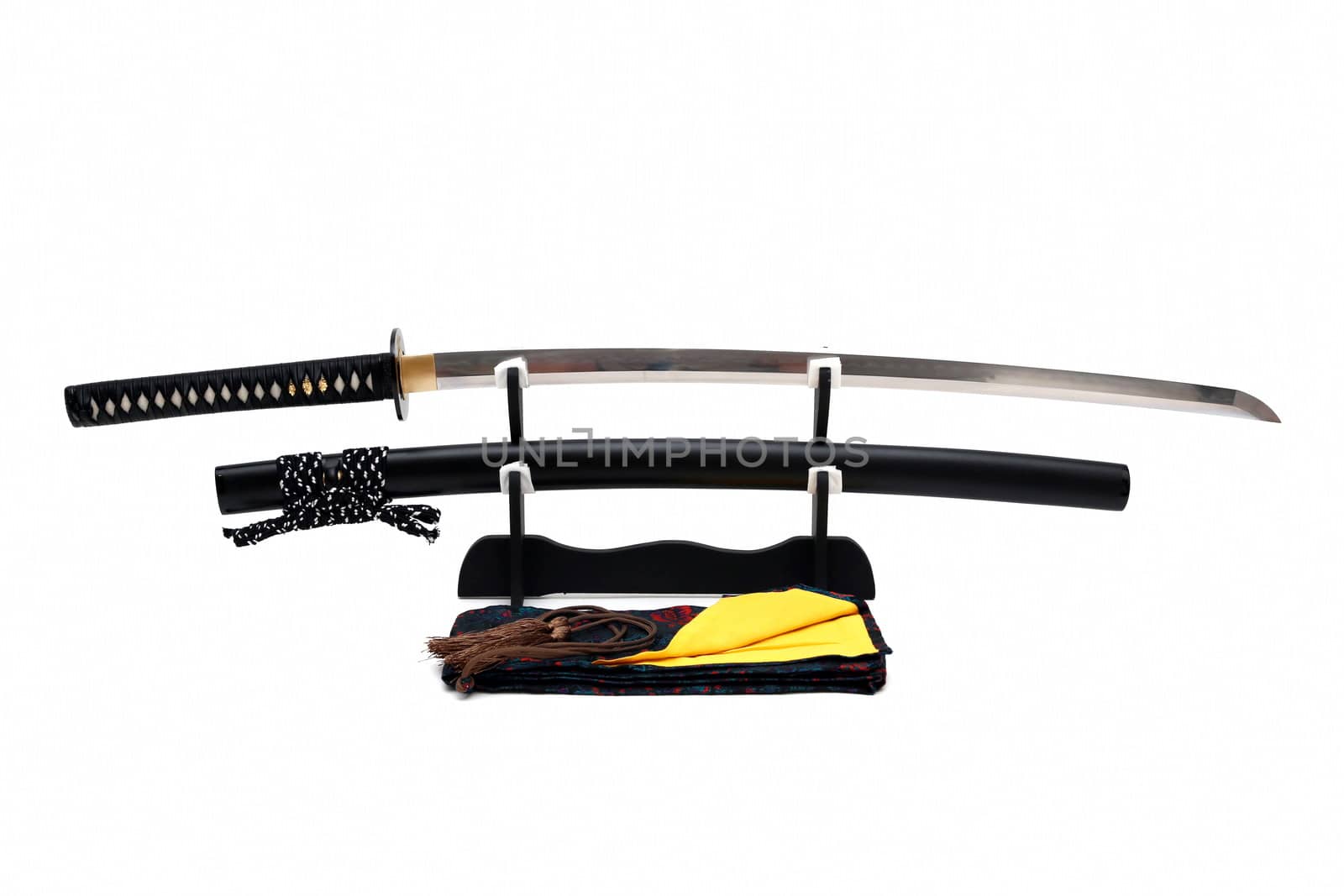 Japanese sword on stand with white background