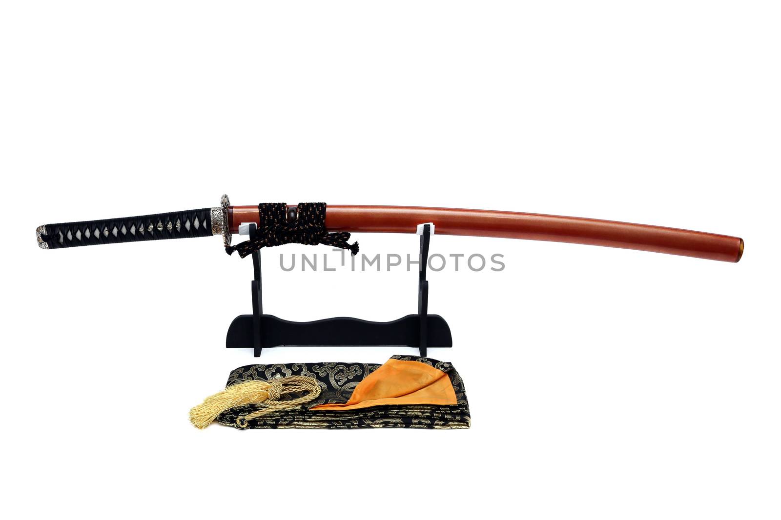 Japanese sword on stand with white background