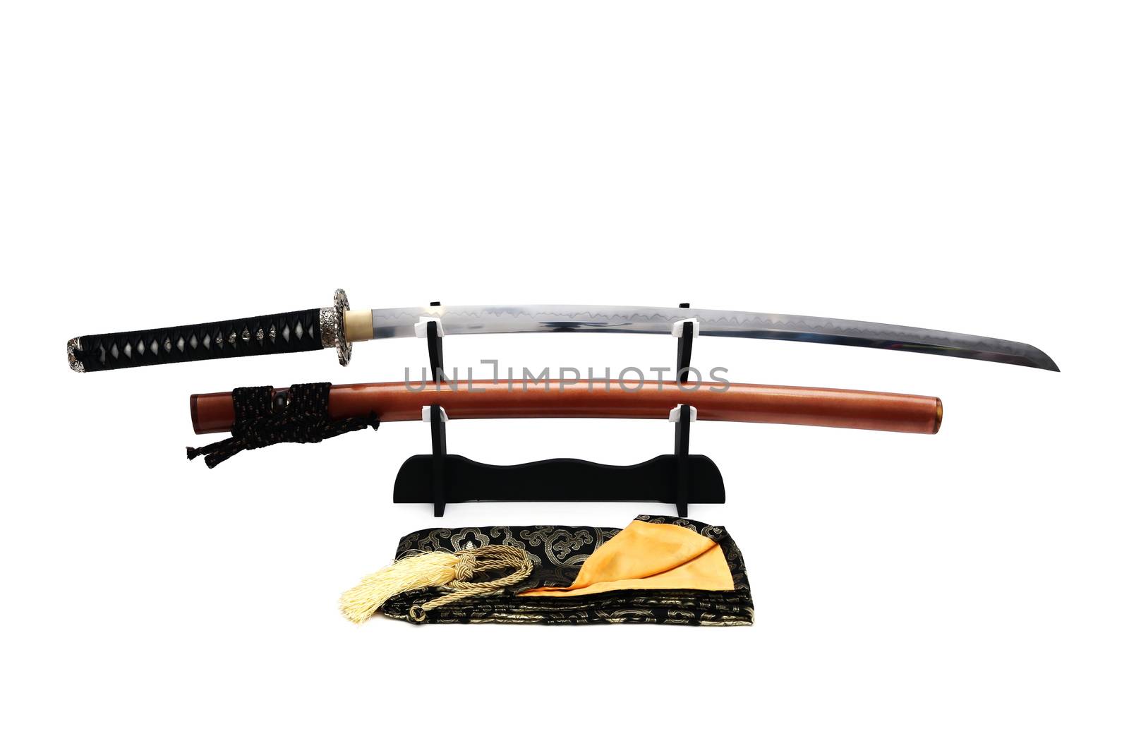 Japanese sword on stand with white background