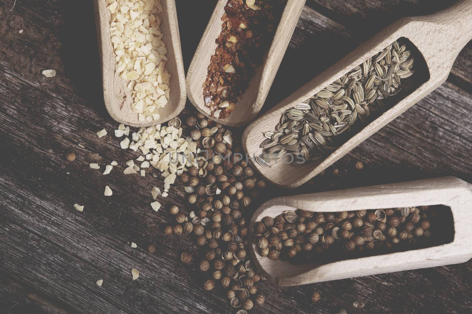 Full of Aroma Spices in the Wooden Kitchen Tools. Four Spices.