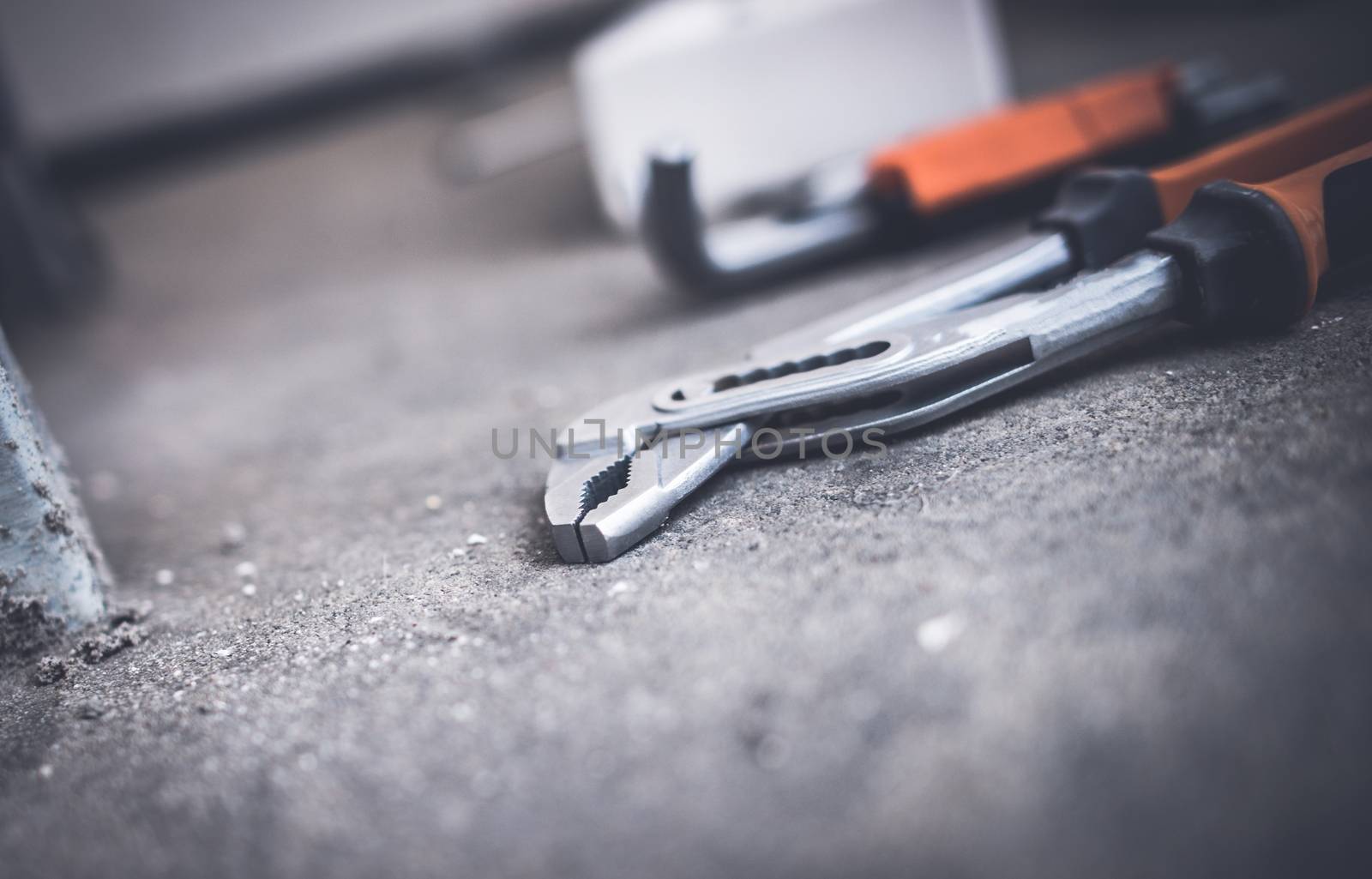 Garage Tools on the Raw Concrete Floor. Fixing Project Concept.
