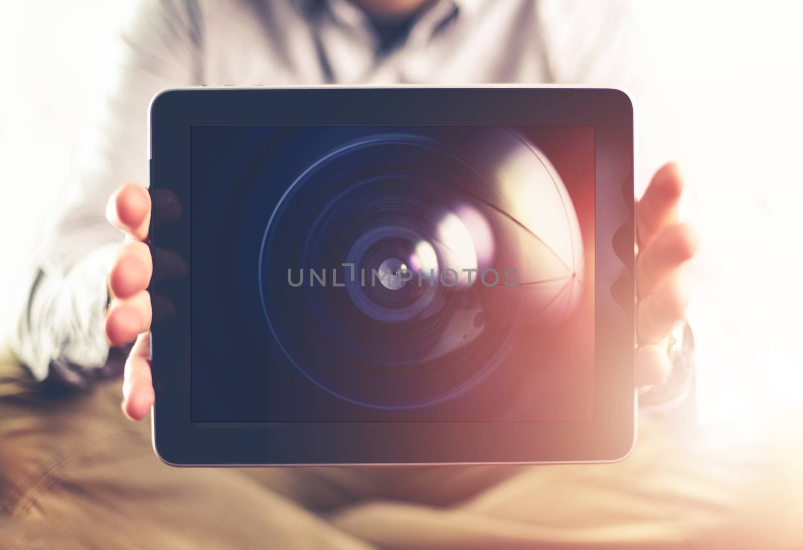 Photography is the Choice Concept Photo. Men with Tablet Device Displaying Photography Lens on the Screen. 