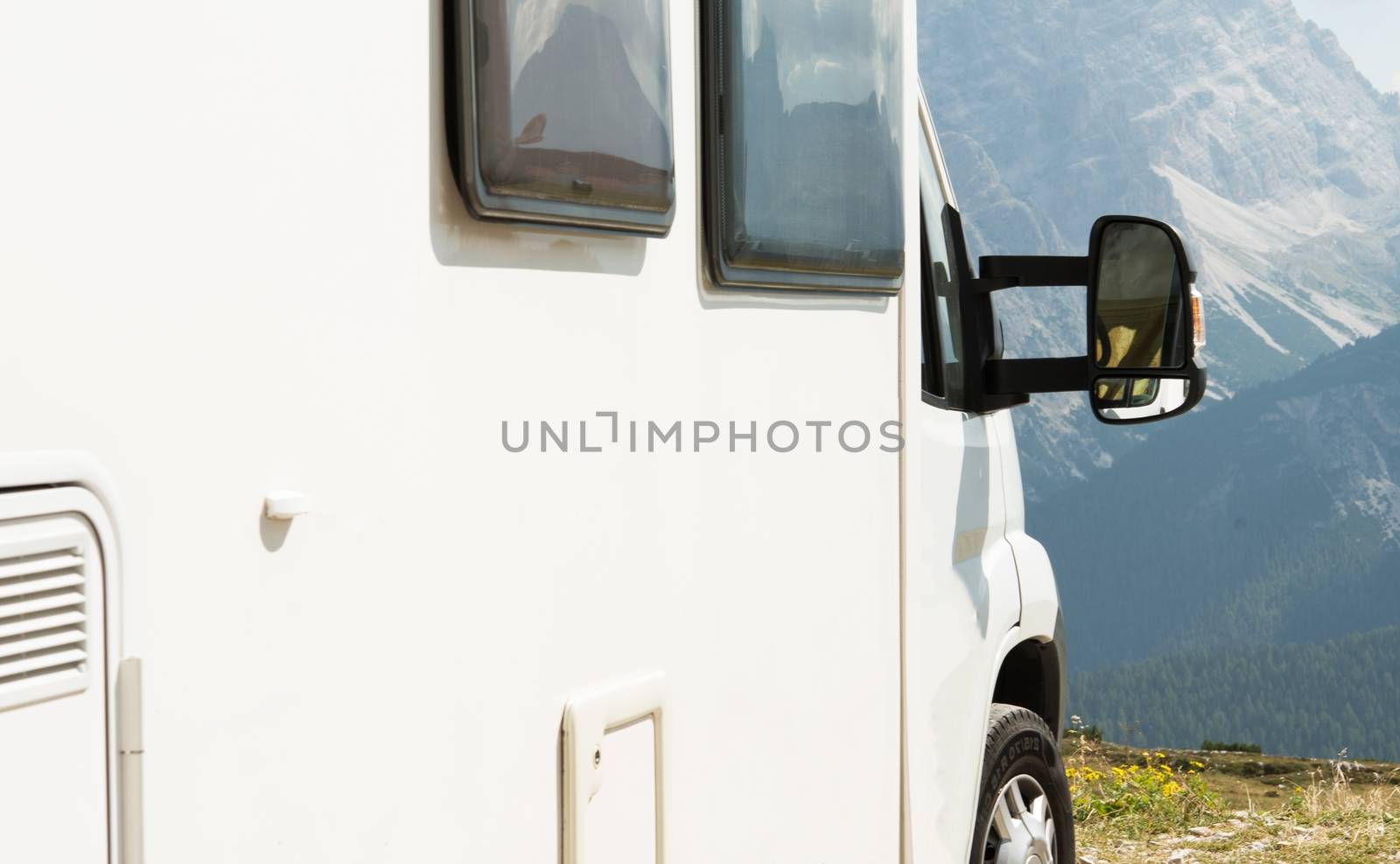 RV Camper Scenic Camping in the Mountains Wilderness. Motorhome Closeup.