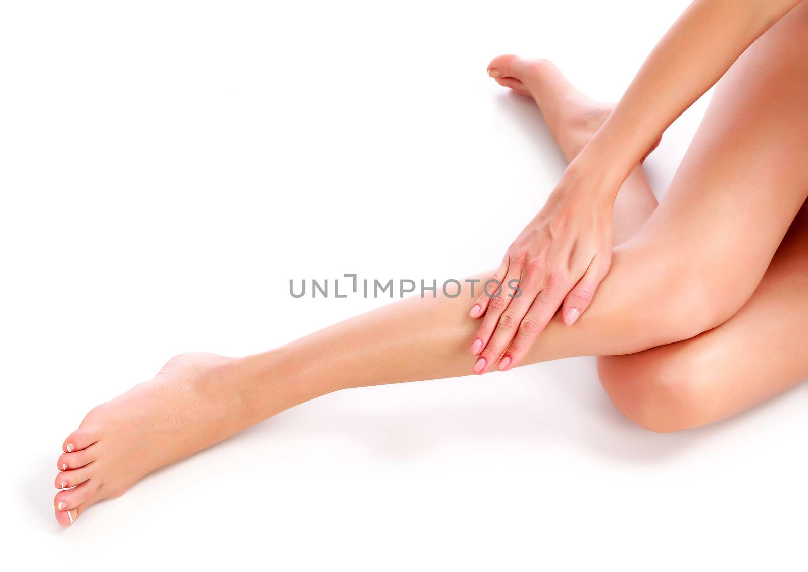 Beautiful woman legs on white background by Nobilior