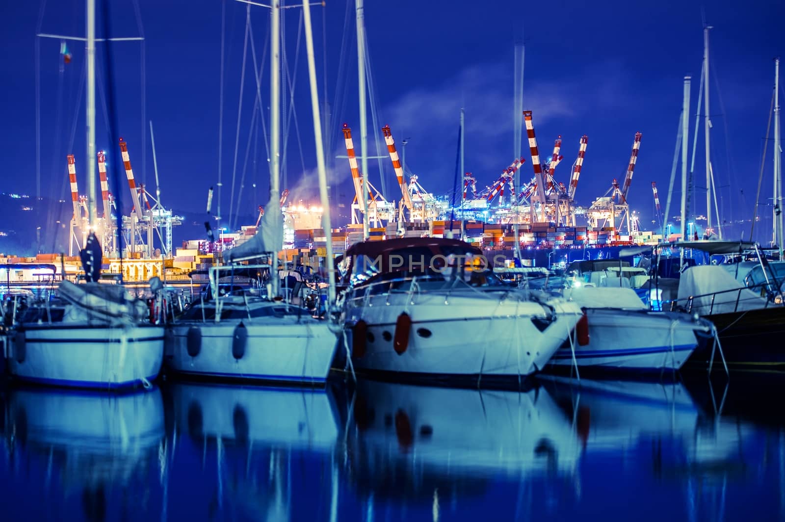 La Spezia Marina Yachts and Container Cargo Terminal in the Background. La Spezia, Liguria, Italy. Night Time Photo.