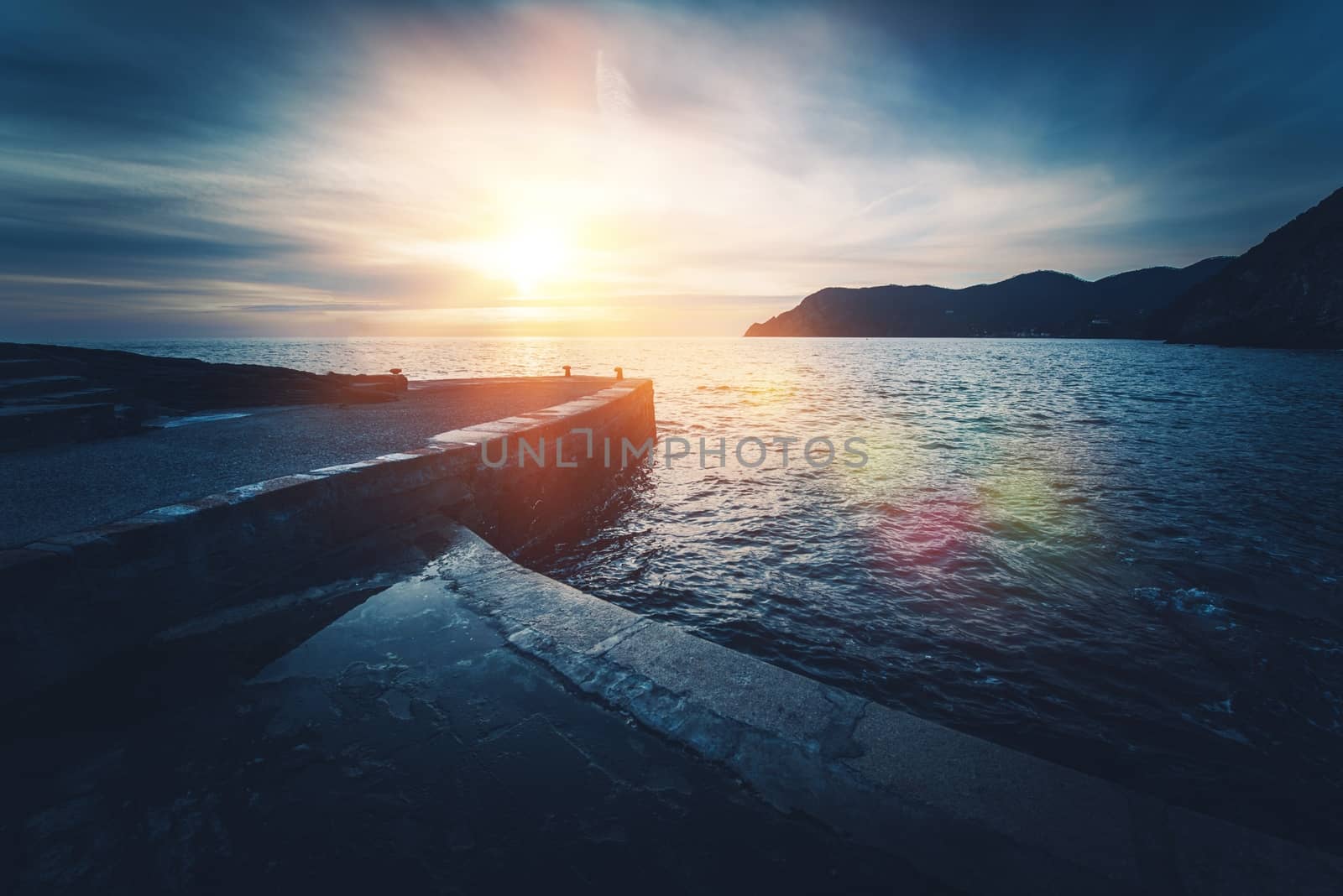 Mediterranean Sea Sunset. Vernazza in Province of La Spezia, Italy. Dark Blue Color Grading.