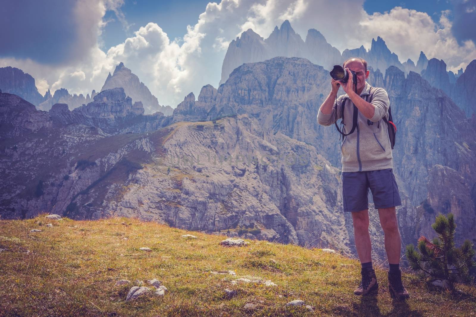 Senior Nature Photographer with Passion. Men in His 50s Taking Nature Images in the Scenic Region of Italian Dolomites.