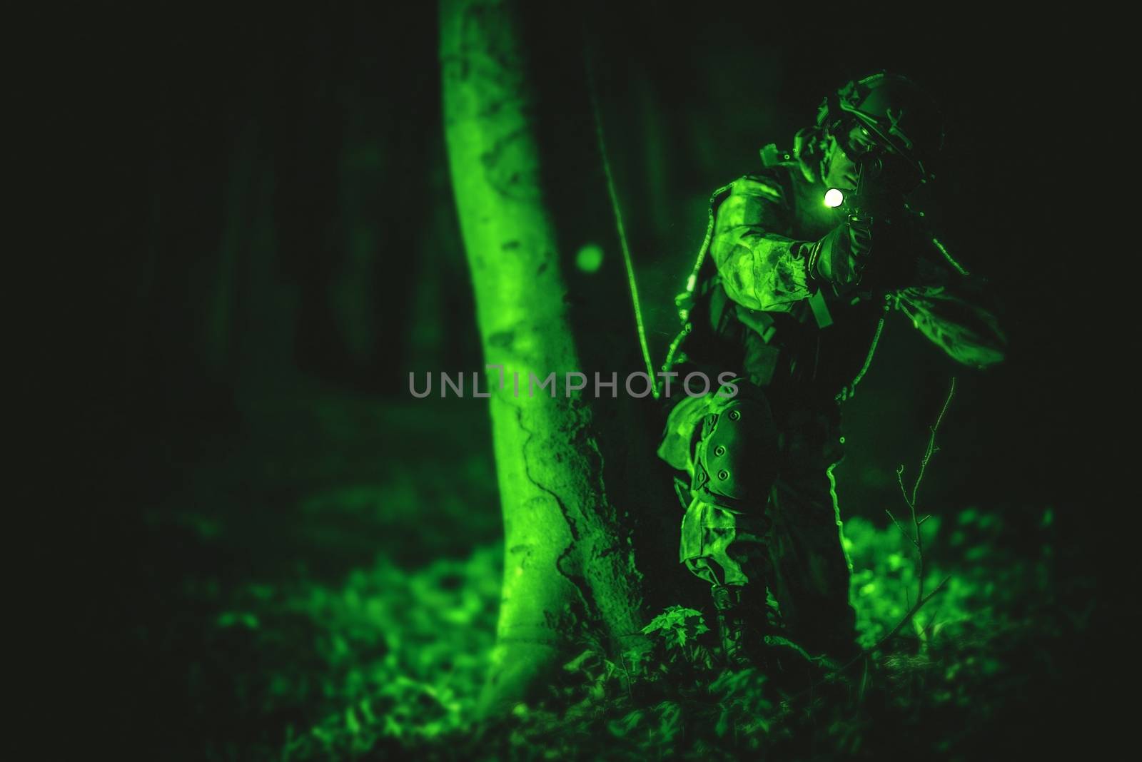 Soldier in Night Vision View. Military Concept Photo. Night Vision Color and Noise Grading.
