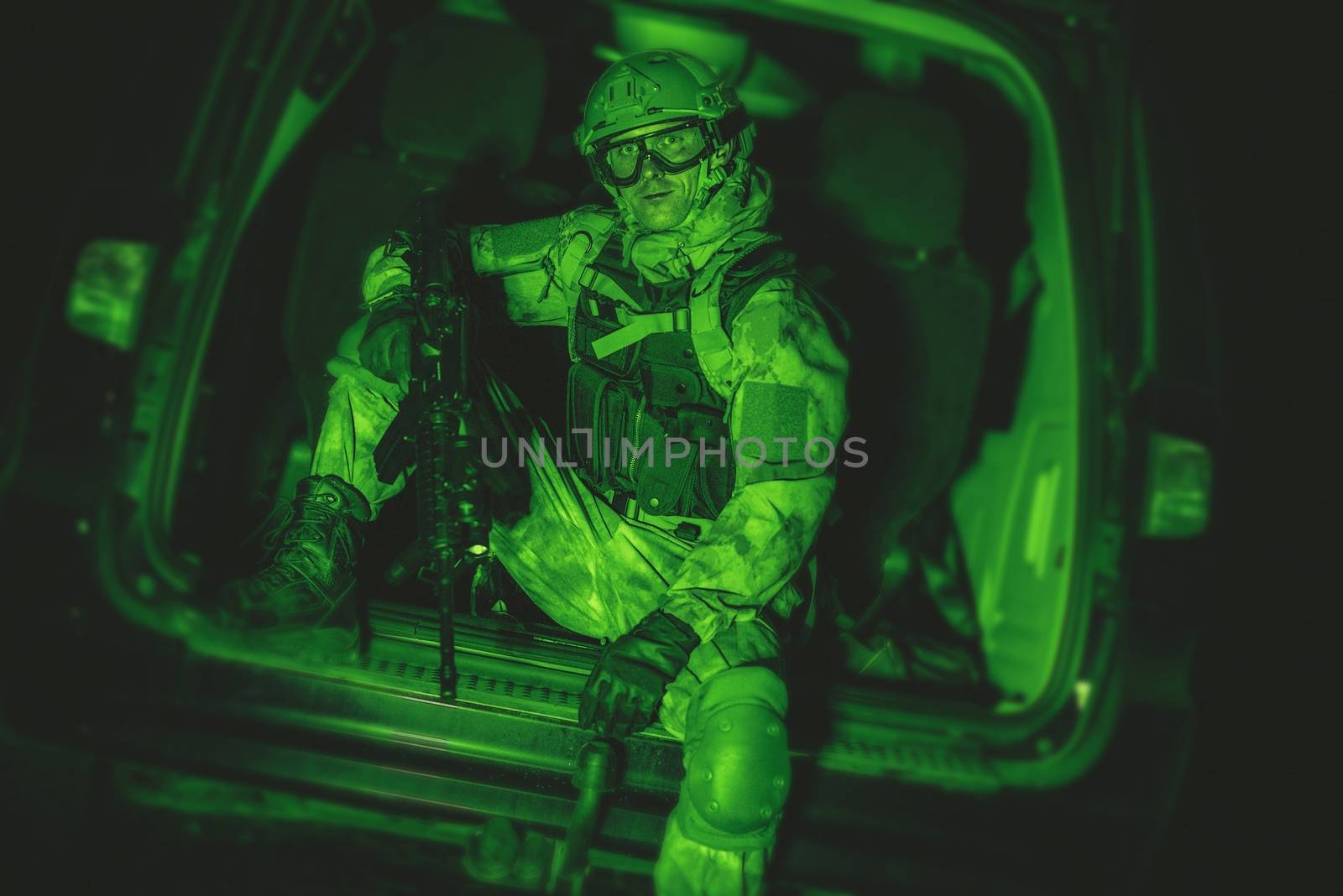 Soldier in the Van. Night Vision Color Grading. Military Technologies.