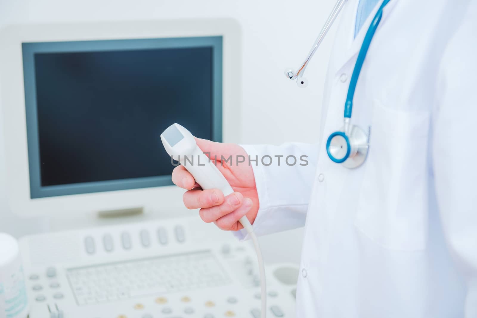 Ultrasonography Testing Concept. Medical Doctor with the Ultrasonography Device in a Hand.