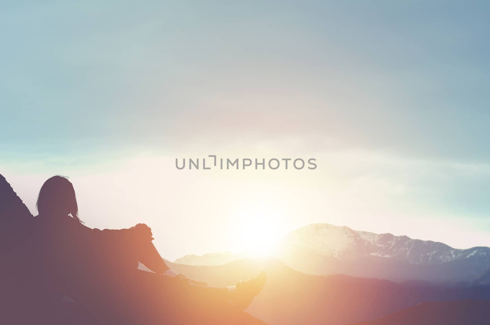 Hiker Watching Sunset Resting on the Large Boulder. Travel 