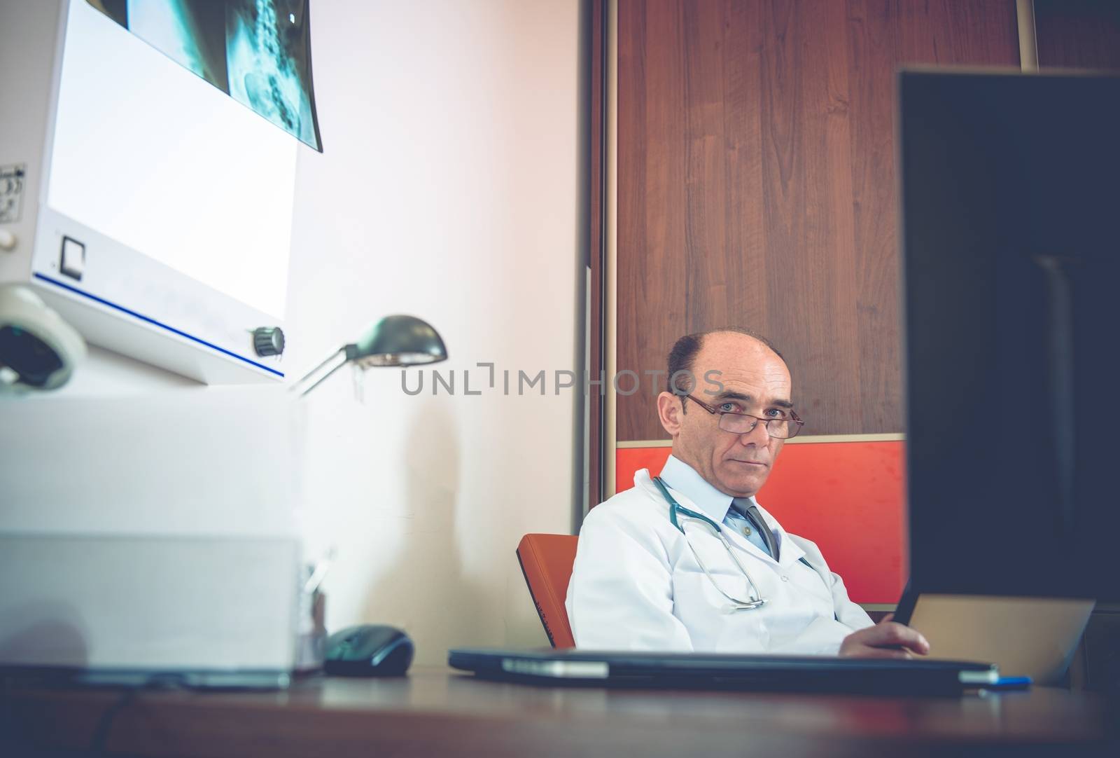 Medical Doctor in His Office by welcomia