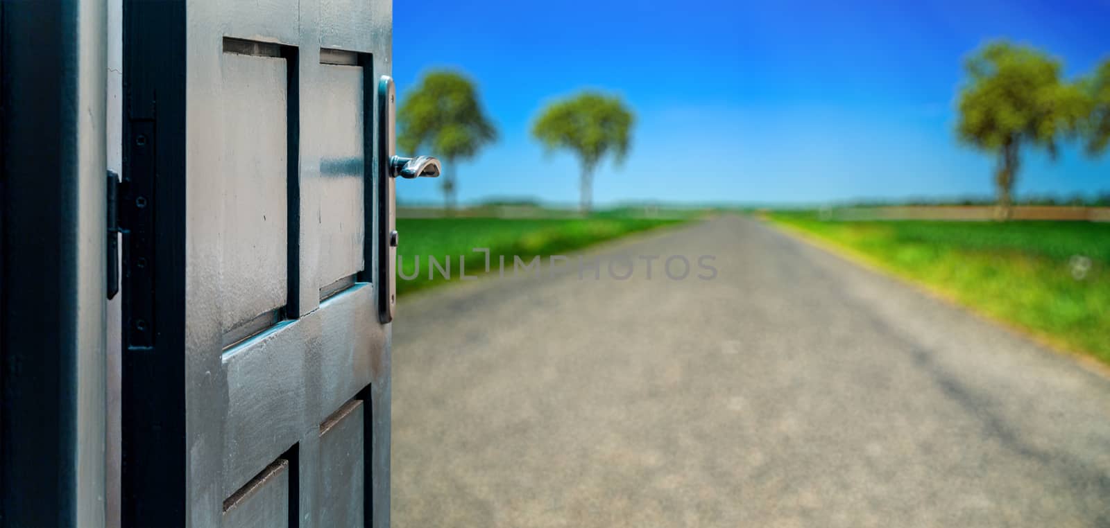 Opened door concept to beautiful road contryside landscape