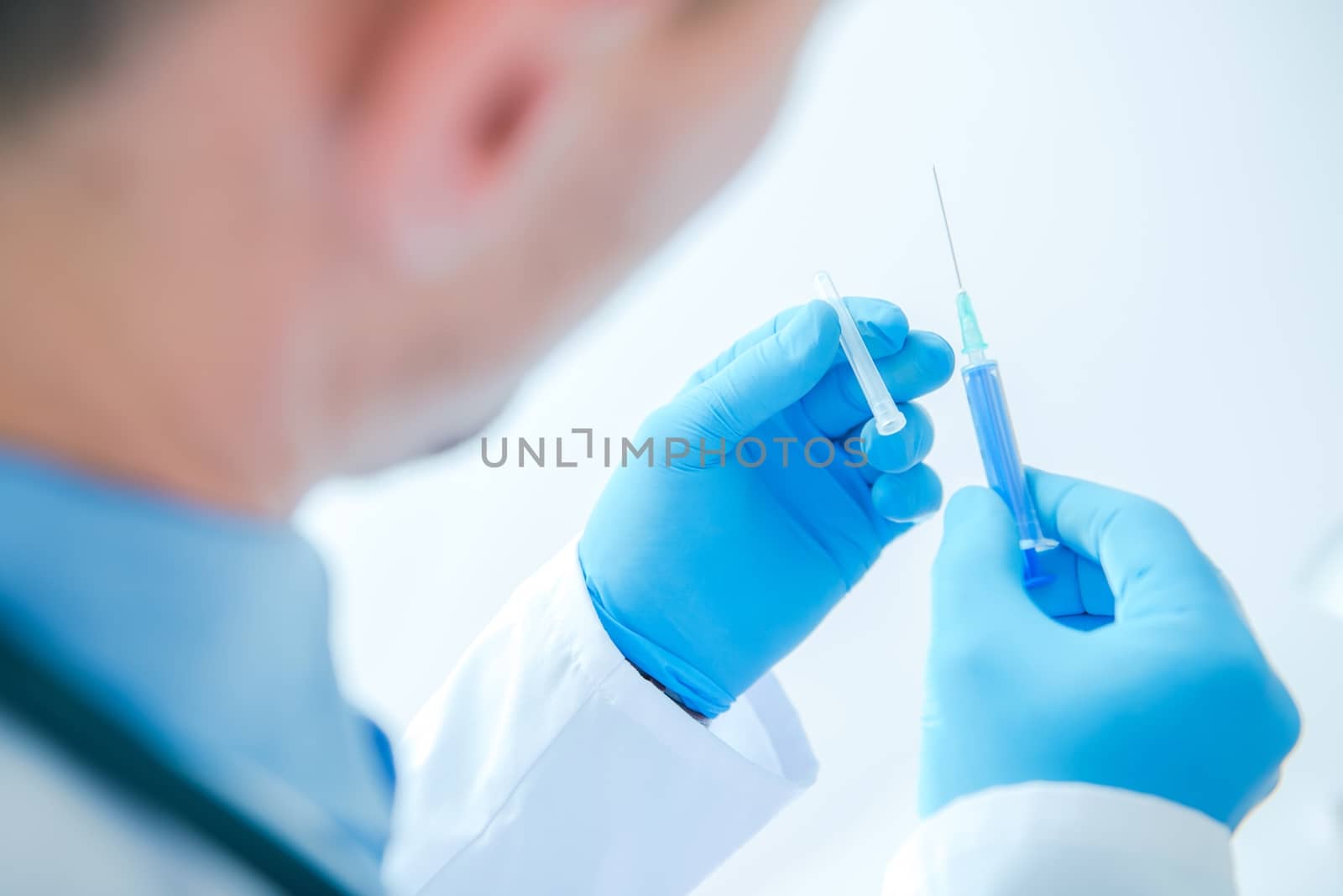 Syringe Injection by Doctor. Medical Doctor Preparing For Injection.