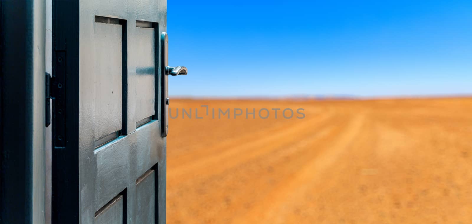 Opened door concept to beautiful and imaginary desert landscape