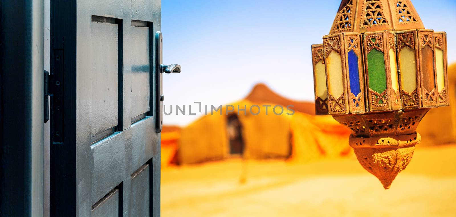 Opened door concept to beautiful berber camp on desert by pixinoo