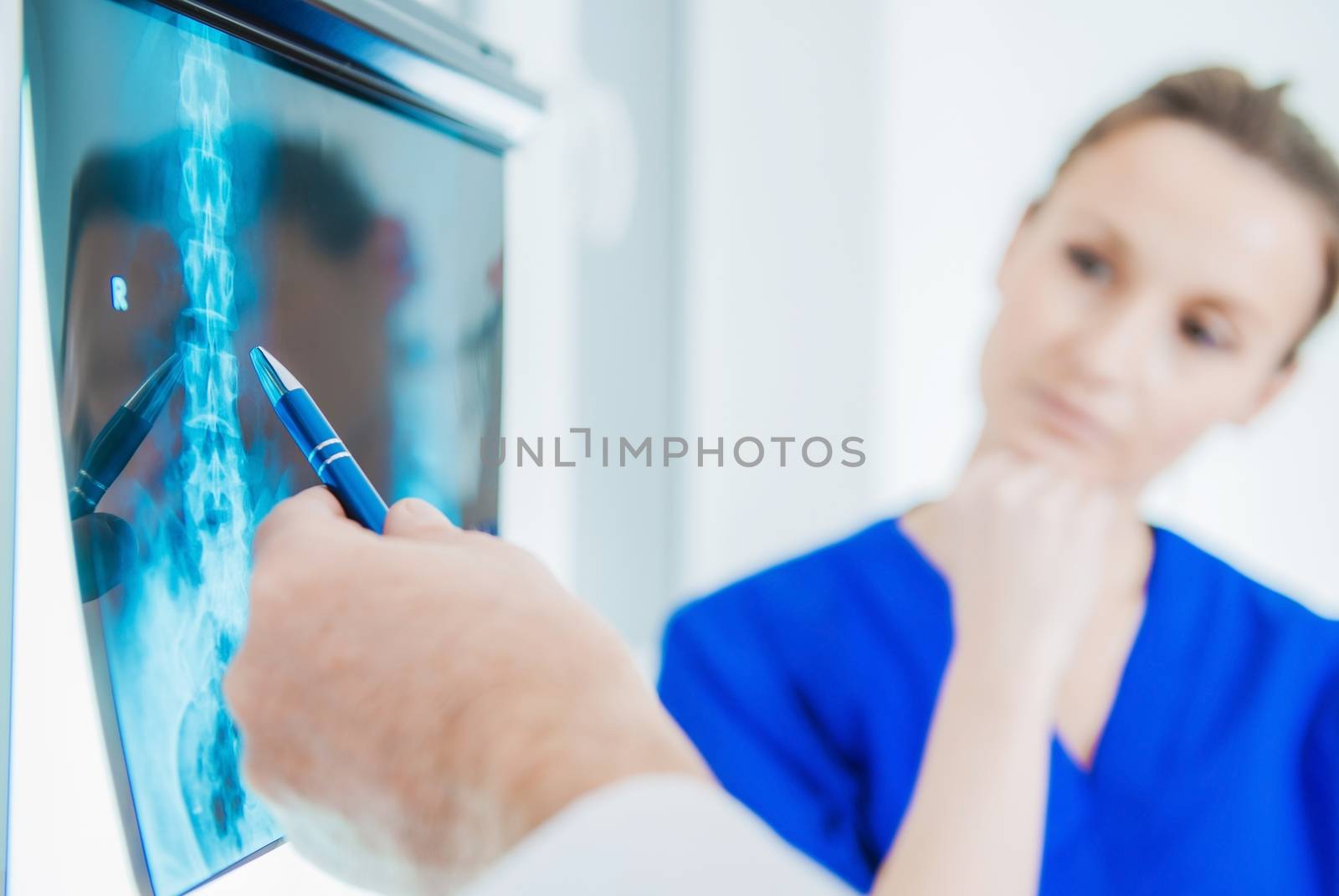 Radiography Xray Diagnose. Hospital Medical Staff Checking on the Xray Imagery.