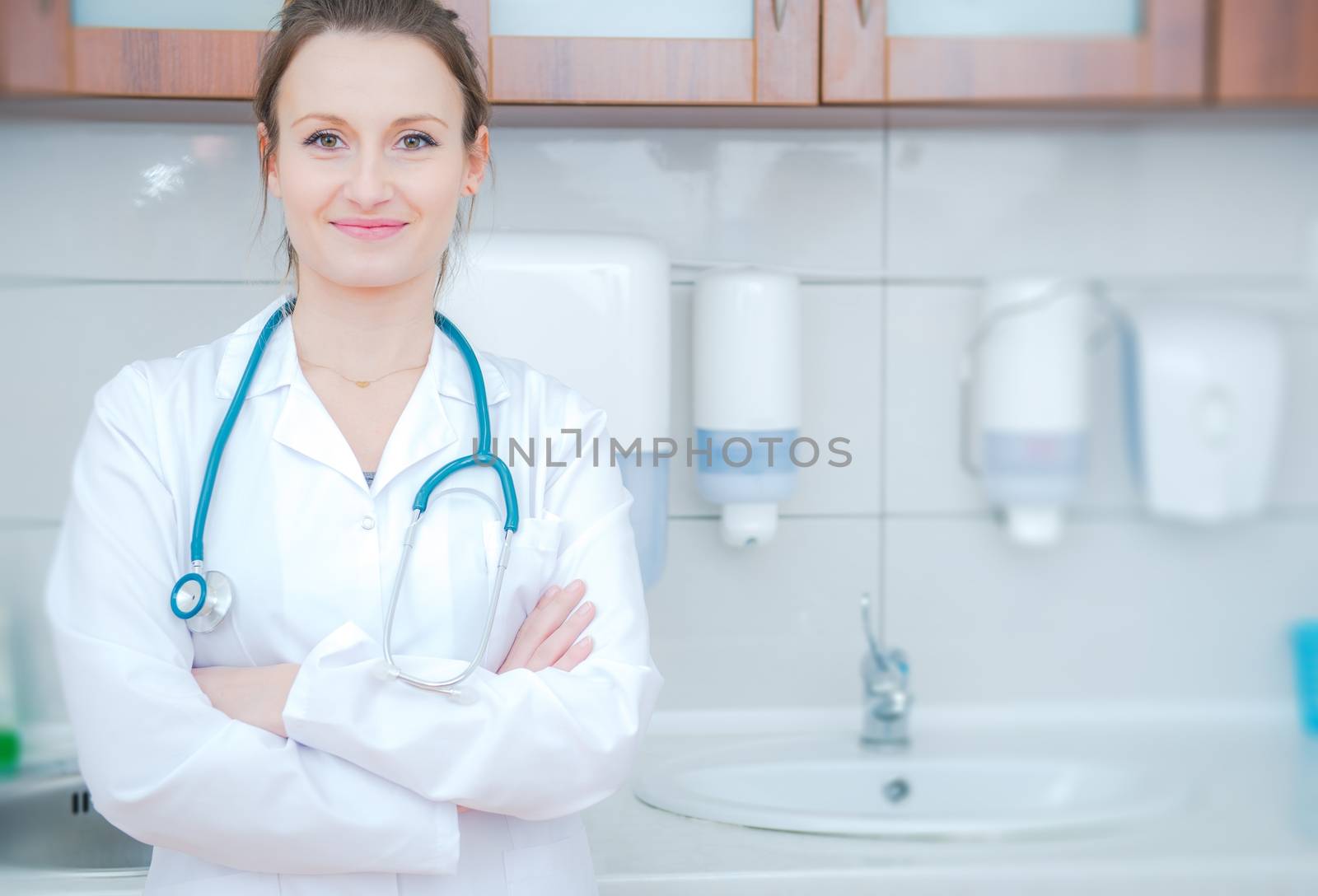 Female Medial Doctor in the Doctors Office. Hospital and Clinics Concept Photo. Caucasian Doctor in Her 30s