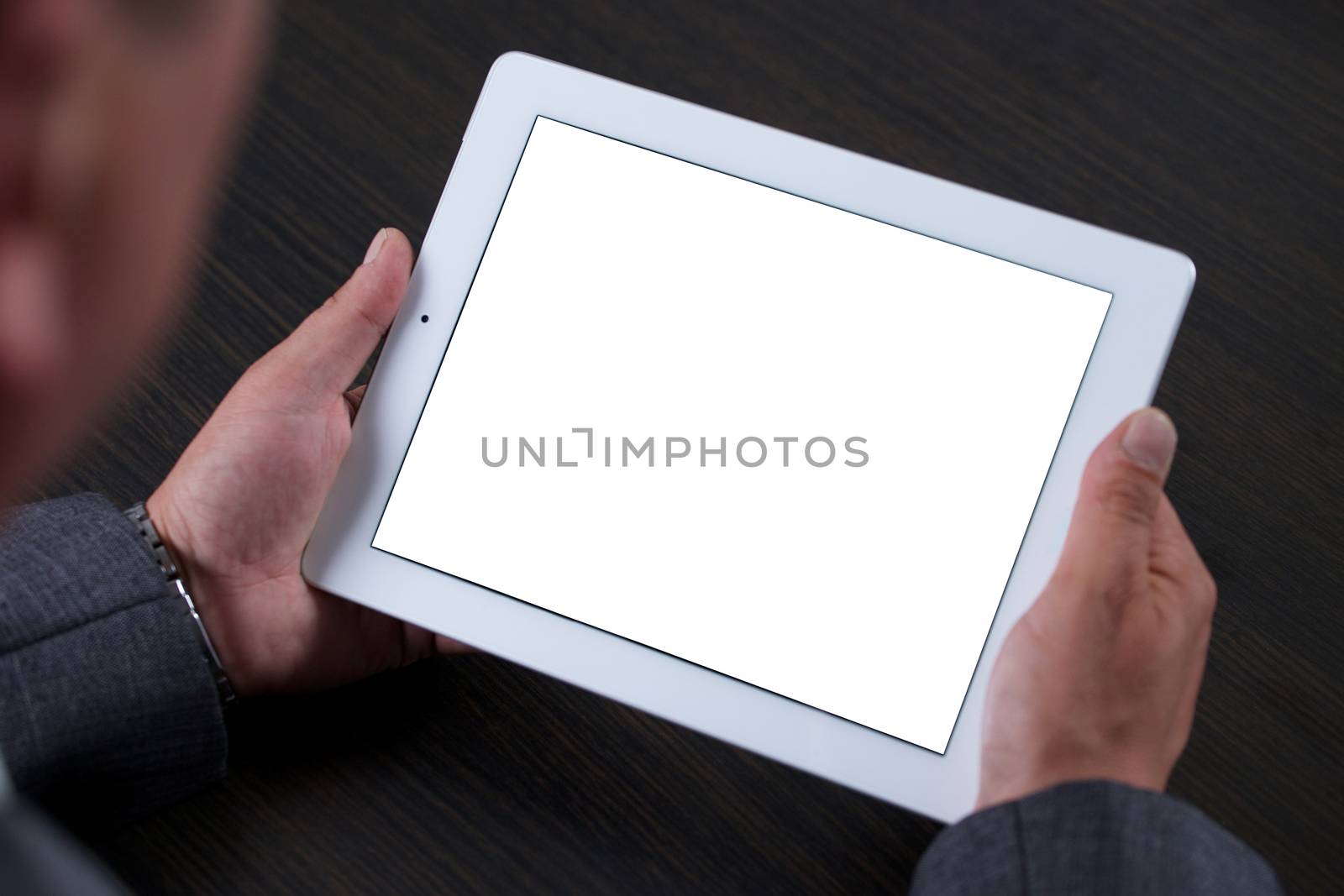 Close up of man using tablet. White screen. by TravelTime