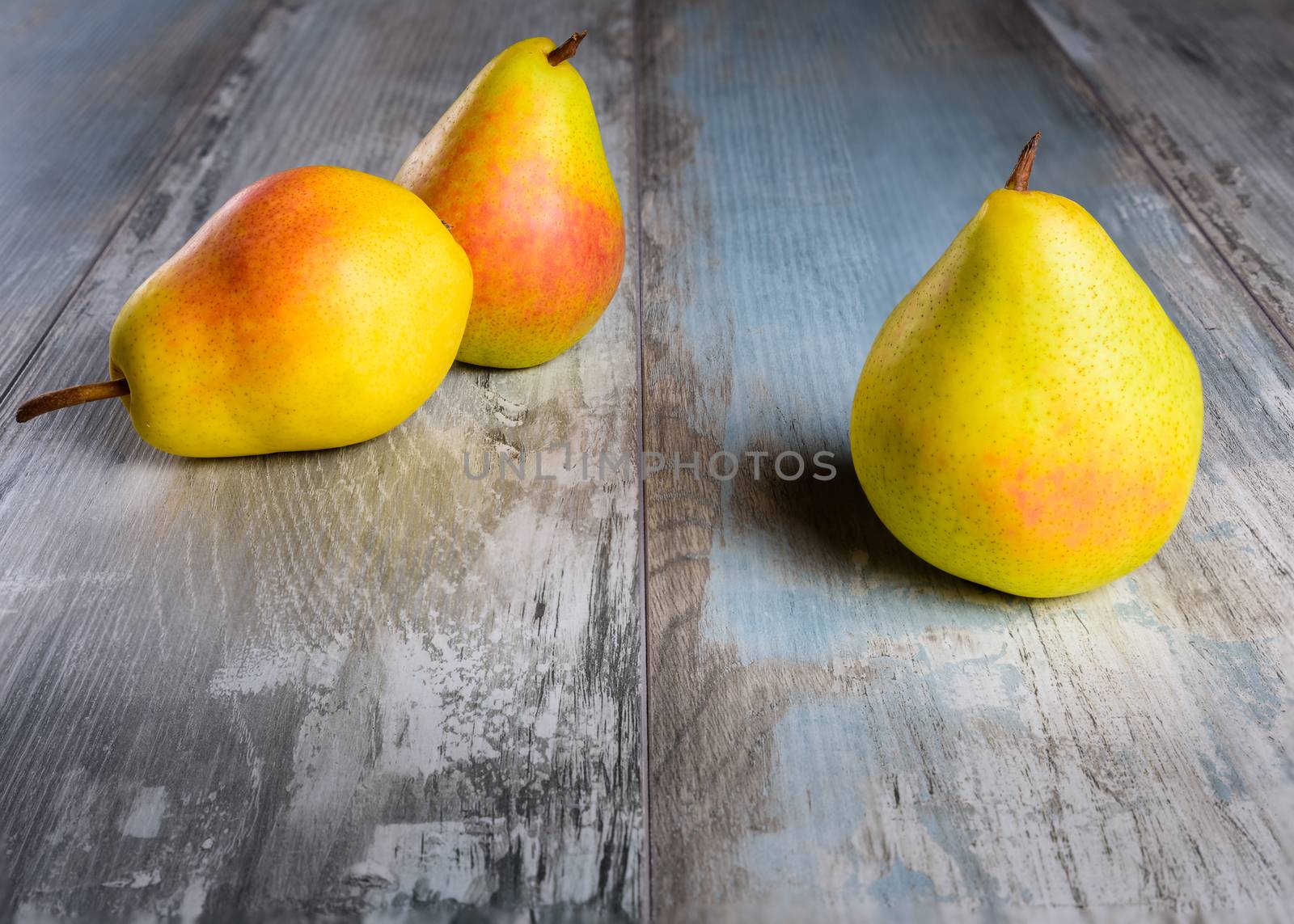 Pears  on an old wooden table (close-up shot).