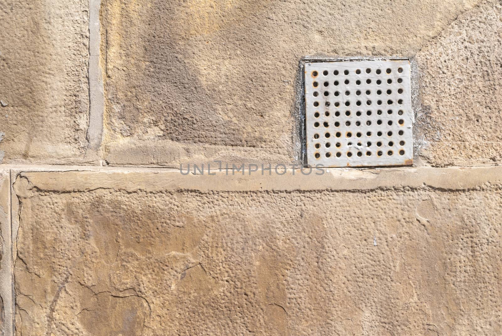 fragment of a concrete wall, which has undergone deformation due to prolonged exposure to various climatic conditions